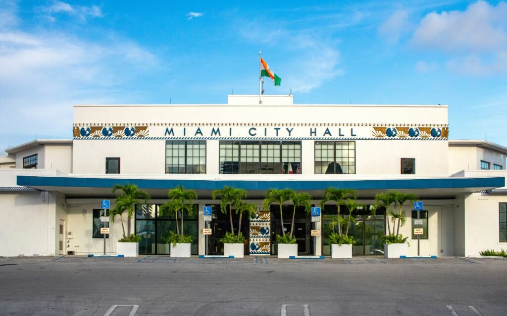 A large white building with a flag on top of it